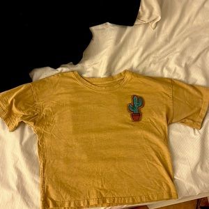 small beige/ tan t shirt with cactus